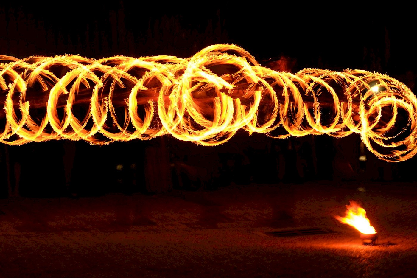 Amazing picture of firedancer looks like flaming hoola hoops - photo Greg Lumley